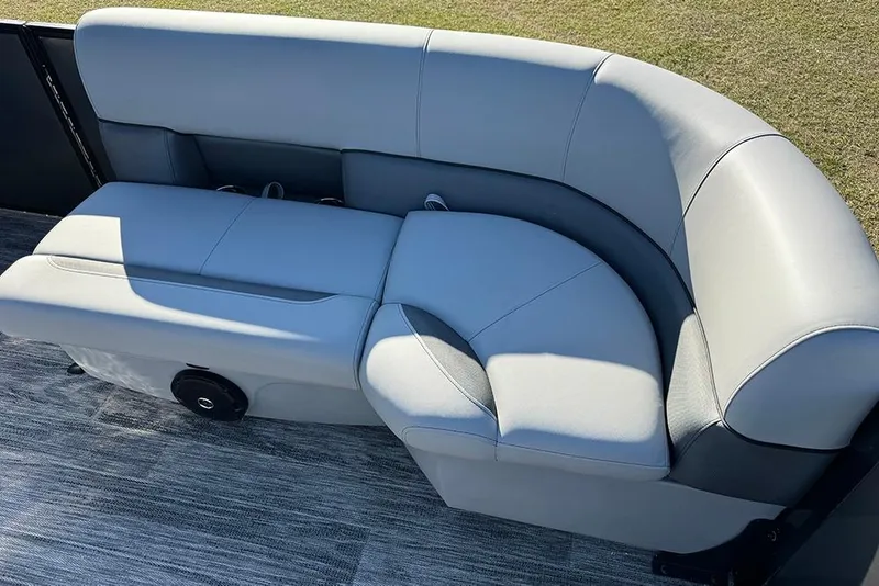 Slide: The Image of 2026 Bentley Pontoons 243 Fish-N-Cruise boat seating, featuring luxurious gray upholstery. - 17