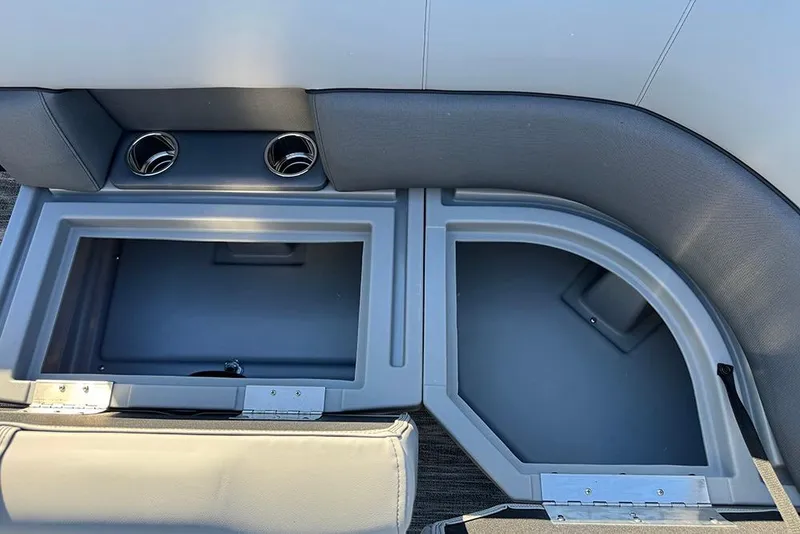 Slide: The Image of 2026 Bentley Pontoons 243 Fish-N-Cruise storage compartments with cup holders. - 18