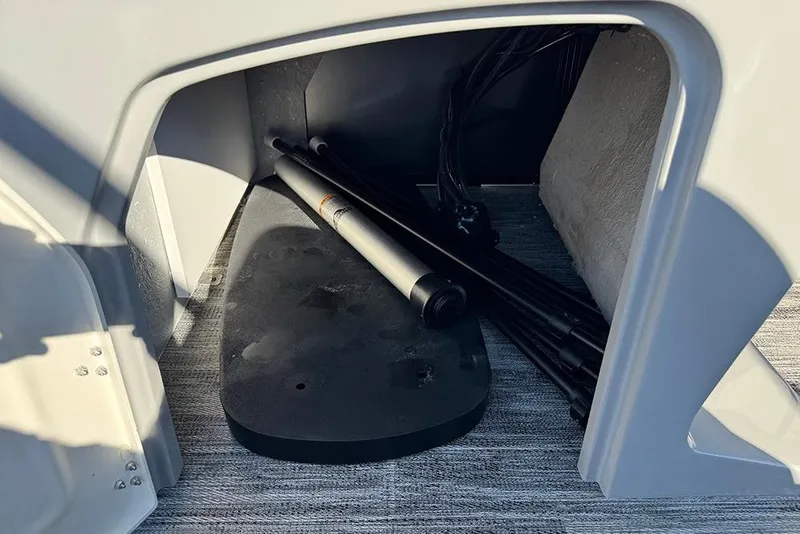 Slide: The Image of Storage compartment of 2026 Bentley Pontoons 243 Fish-N-Cruise with equipment inside. - 21