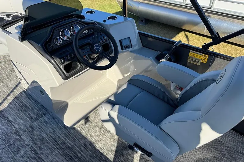 Slide: The Image of Interior view of 2026 Bentley Pontoons 243 Fish-N-Cruise helm with steering wheel and controls. - 29