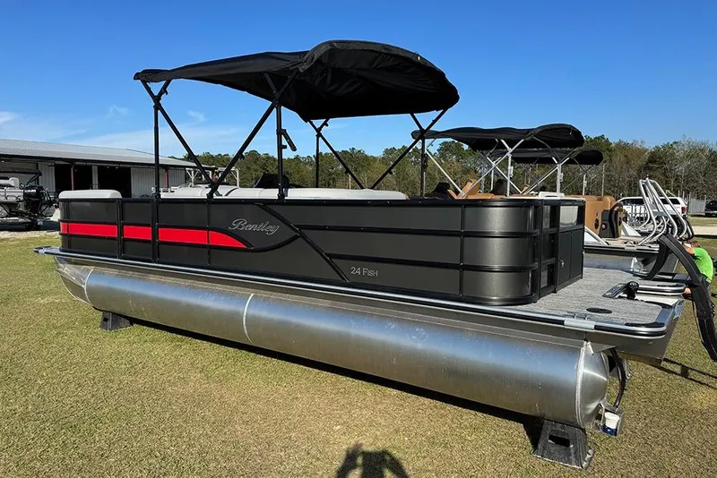 Slide: The Image of 2026 Bentley Pontoons 243 Fish-N-Cruise pontoon boat with black canopy on display. - 3