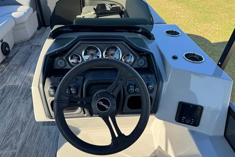 Slide: The Image of Steering console of 2026 Bentley Pontoons 243 Fish-N-Cruise with gauges and controls. - 30