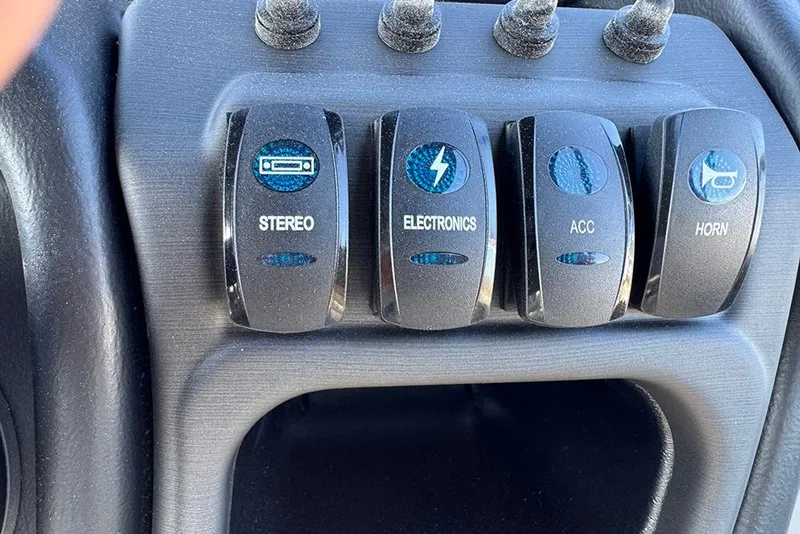 Slide: The Image of Control panel of 2026 Bentley Pontoons 243 Fish-N-Cruise with labeled switches. - 32