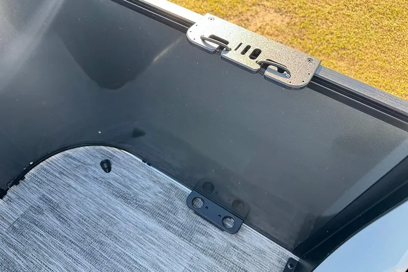 Slide: The Image of Interior view of 2026 Bentley Pontoons 243 Fish-N-Cruise, featuring sleek flooring and sturdy railing. - 43