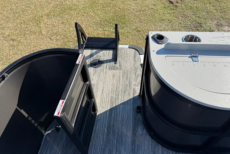 Slide: The Image of 2026 Bentley Pontoons 243 Fish-N-Cruise deck with fishing station and ladder. - 45