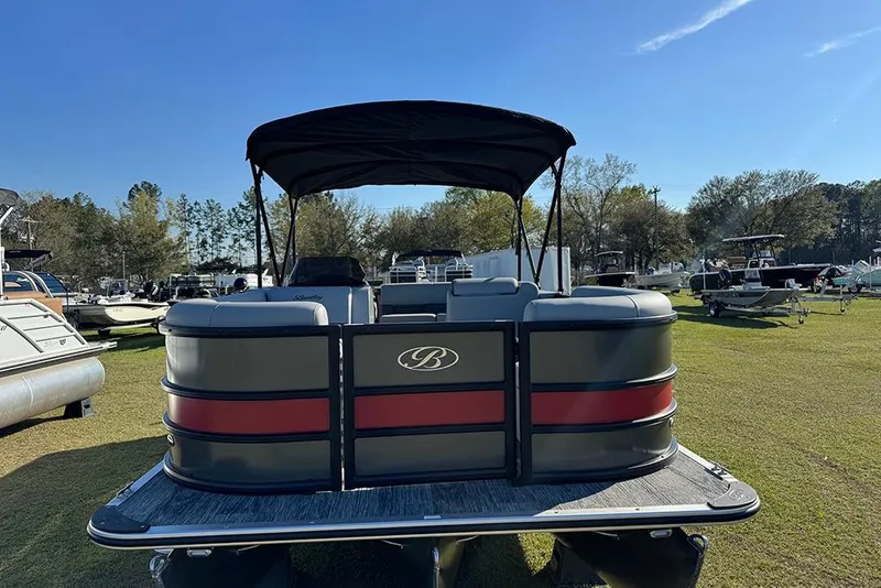 Slide: The Image of 2026 Bentley Pontoons 243 Fish-N-Cruise pontoon boat on grassy field. - 9