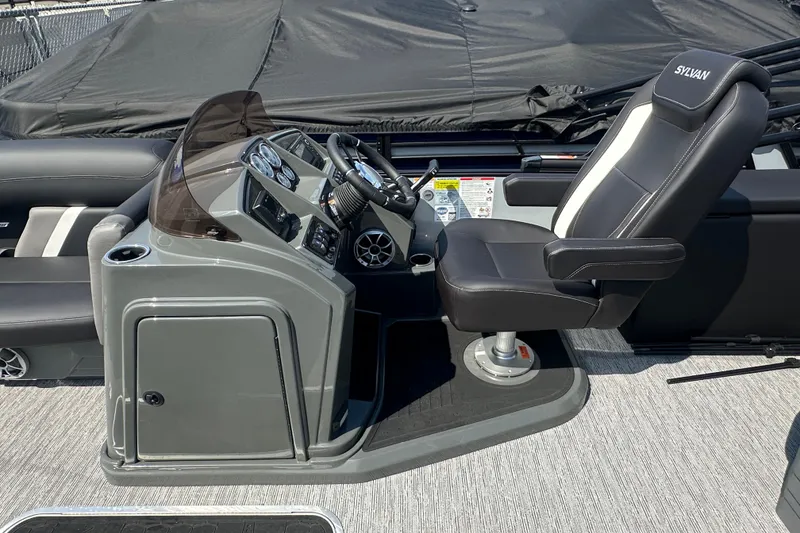 Slide: The Image of 2026 Sylvan X3 CLZ DH boat cockpit with steering wheel and captain's chair. - 18