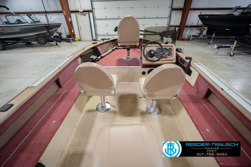 Slide: The Image of 1997 Lund 1650 Angler SS boat interior with steering console and seating. - 15