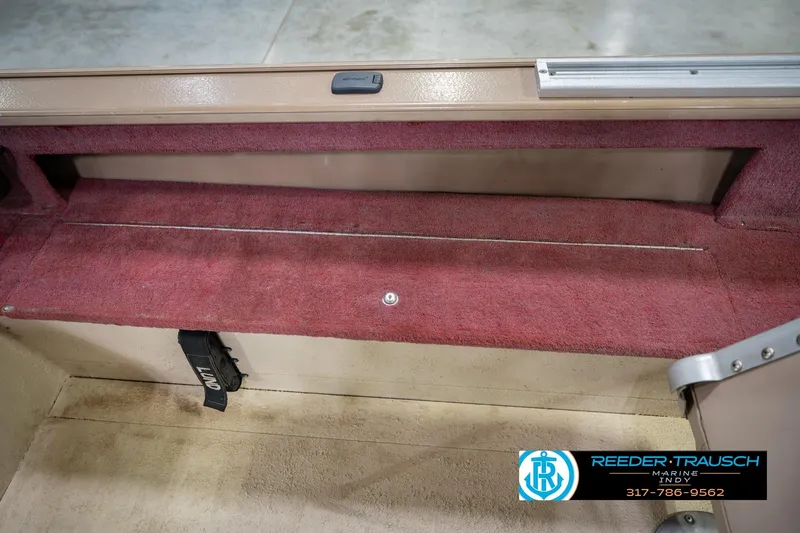 Slide: The Image of Interior view of a 1997 Lund 1650 Angler SS boat storage compartment. - 23