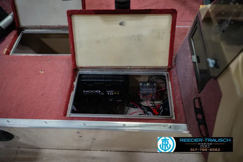 Slide: The Image of Battery compartment of a 1997 Lund 1650 Angler SS boat with NOCO Genius charger. - 26