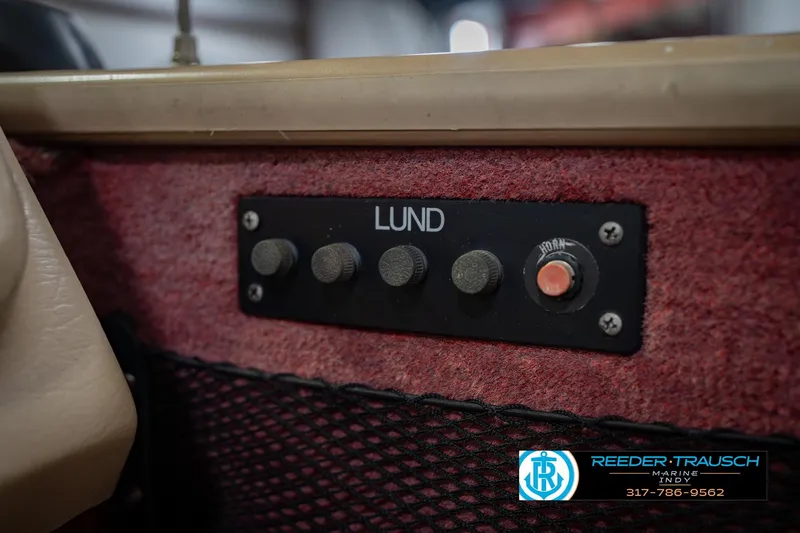 Slide: The Image of Control panel of a 1997 Lund 1650 Angler SS boat with horn button. - 33