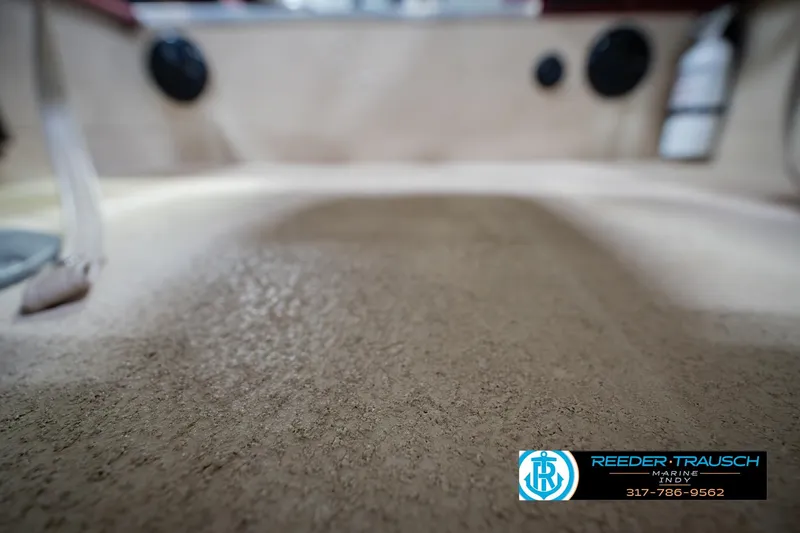 Slide: The Image of Interior view of a 1997 Lund 1650 Angler SS boat, featuring textured flooring. - 41