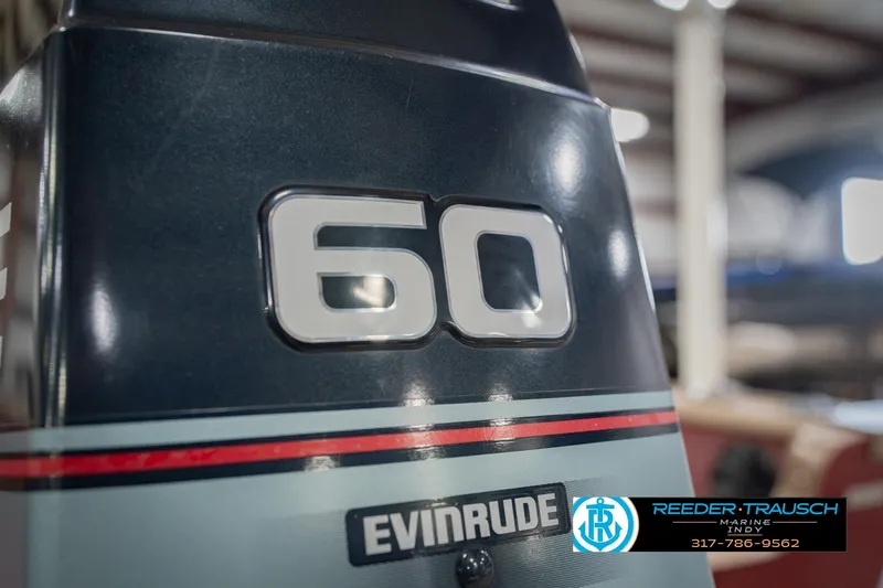Slide: The Image of Evinrude 60 horsepower outboard motor on a 1997 Lund 1650 Angler SS boat. - 44