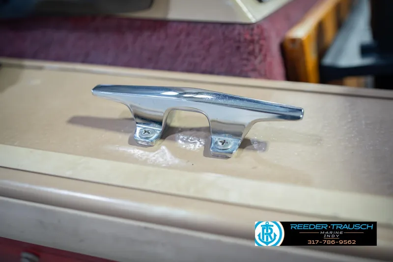 Slide: The Image of Chrome boat cleat on a 1997 Lund 1650 Angler SS, Reeder-Trausch Marine logo visible. - 55