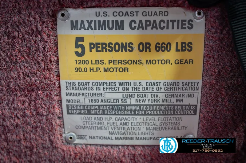 Slide: The Image of 1997 Lund 1650 Angler SS capacity plate, 5 persons or 660 lbs, 90 HP motor. - 56