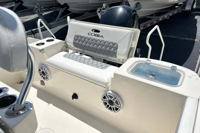 Slide: The Image of 2019 Cobia 220 Center Console boat interior with seating and storage features. - 20