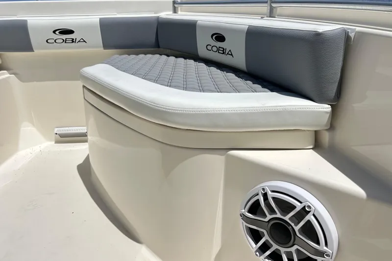 Slide: The Image of 2019 Cobia 220 Center Console boat interior with cushioned seating and speaker. - 4