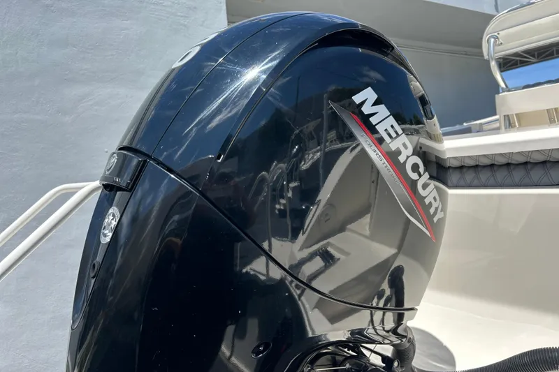 Slide: The Image of Mercury outboard motor on a 2019 Cobia 220 Center Console boat, close-up view. - 8