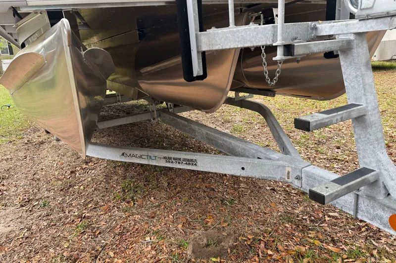 Slide: The Image of 2025 Godfrey Sweetwater 2286 pontoon boat on a Magic Tilt trailer. - 14