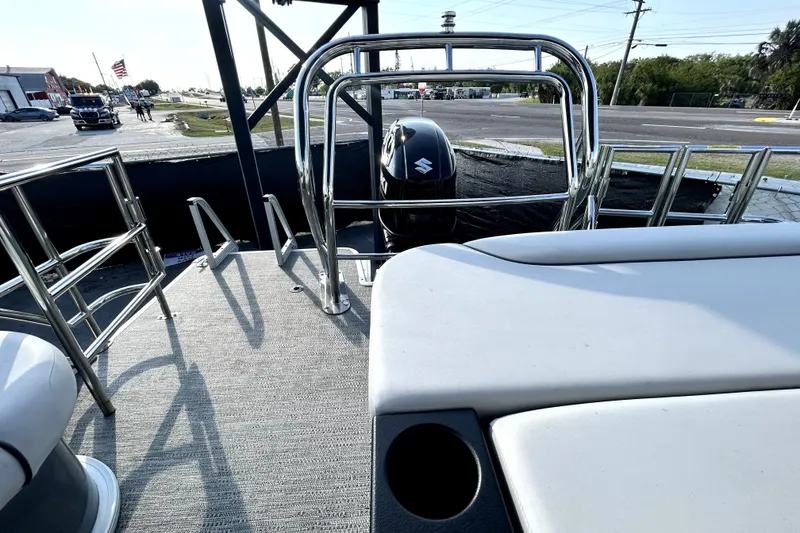 Slide: The Image of 2025 Godfrey Sweetwater 2286 SFL pontoon boat interior with canopy and seating. - 15