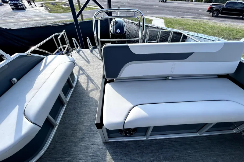 Slide: The Image of 2025 Godfrey Sweetwater 2286 SFL pontoon boat interior with plush seating and canopy. - 16