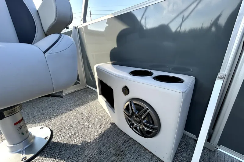 Slide: The Image of 2025 Godfrey Sweetwater 2286 SFL pontoon boat interior with plush seating and canopy. - 18
