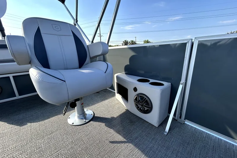 Slide: The Image of Captain's chair and speaker on 2025 Godfrey Sweetwater 2286 SFL pontoon boat. - 19