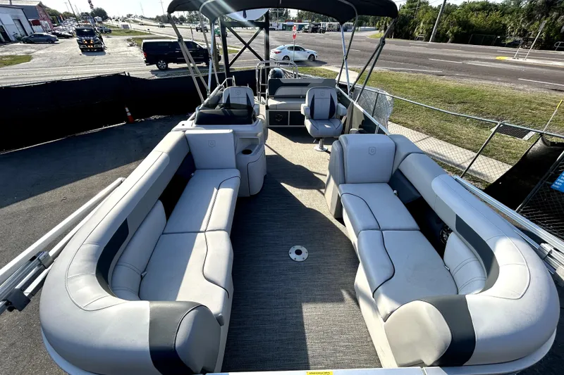 Slide: The Image of 2025 Godfrey Sweetwater 2286 SFL boat interior with plush captain's chair and modern design. - 20