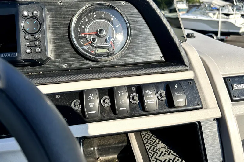 Slide: The Image of Captain's chair on 2025 Godfrey Sweetwater 2286 SFL pontoon boat, featuring sleek design. - 23