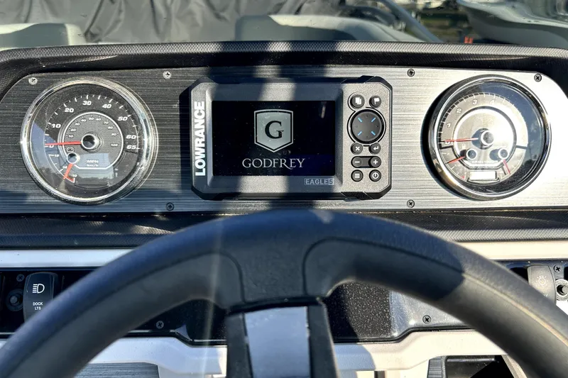 Slide: The Image of 2025 Godfrey Sweetwater 2286 SFL pontoon boat interior with plush seating and canopy. - 25