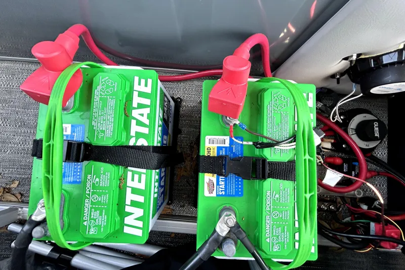 Slide: The Image of 2025 Godfrey Sweetwater 2286 SFL pontoon boat deck with Suzuki outboard motor. - 37