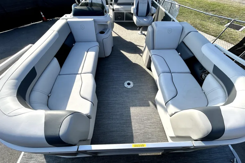 Slide: The Image of Interior view of 2025 Godfrey Sweetwater 2286 SFL pontoon boat at a marina. - 45