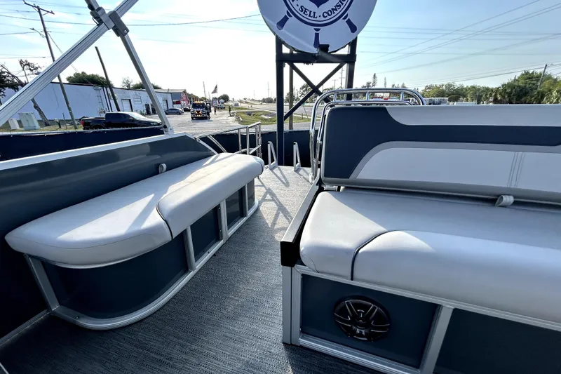 Slide: The Image of 2025 Godfrey Sweetwater 2286 SFL pontoon boat interior with modern seating and steering console. - 50