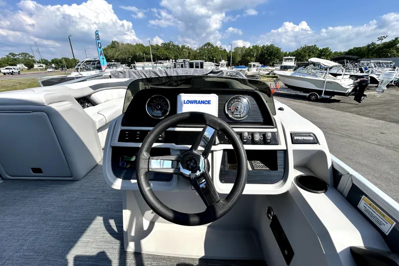 Slide: The Image of Interior view of 2025 Godfrey Sweetwater 2286 SFL pontoon boat with modern seating and steering console. - 53