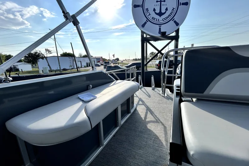 Slide: The Image of Interior view of 2025 Godfrey Sweetwater 2286 SFL pontoon boat with steering console and seating. - 55
