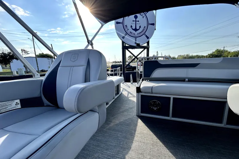 Slide: The Image of Cockpit view of 2025 Godfrey Sweetwater 2286 SFL boat with steering wheel and dashboard. - 56