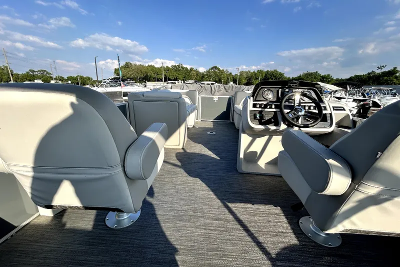 Slide: The Image of Dashboard of 2025 Godfrey Sweetwater 2286 SFL boat with control switches and gauges. - 60