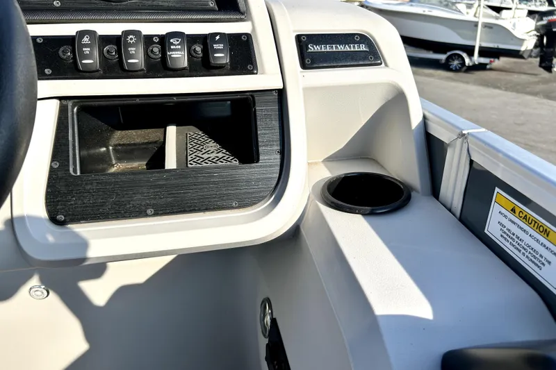 Slide: The Image of Close-up of a 2025 Godfrey Sweetwater 2286 SFL tachometer displaying 5.9 RPM x 1000. - 61