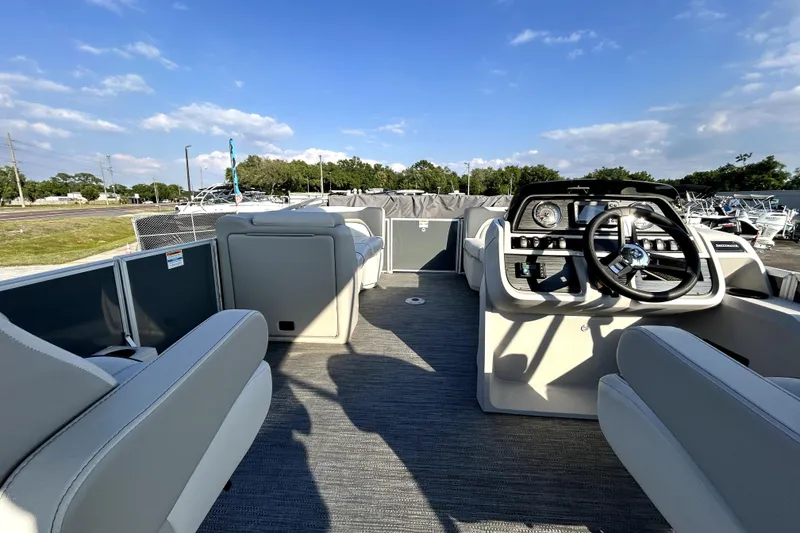 Slide: The Image of Clarion CMM-10 radio displaying FM 93.7 on a Godfrey Sweetwater 2286 SFL, 2025 model. - 62