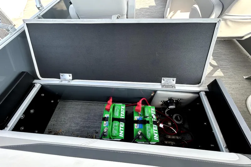 Slide: The Image of Control panel of 2025 Godfrey Sweetwater 2286 SFL boat with cup holder and caution label. - 63