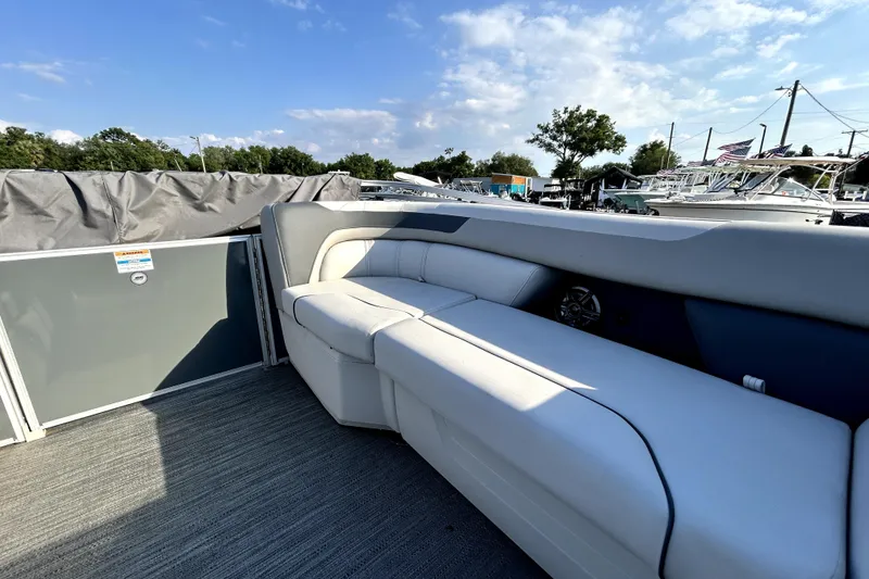 Slide: The Image of 2025 Godfrey Sweetwater 2286 SFL pontoon boat interior with plush seating and open deck. - 67