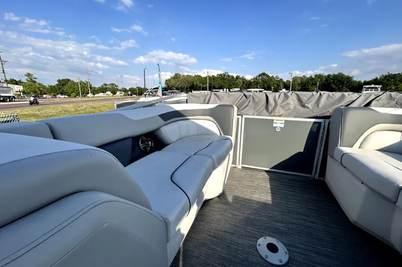 Slide: The Image of 2025 Godfrey Sweetwater 2286 SFL pontoon boat interior with plush seating and open deck. - 71