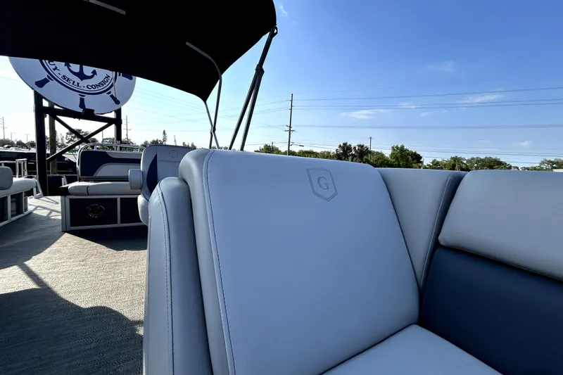 Slide: The Image of Two Interstate batteries in a 2025 Godfrey Sweetwater 2286 SFL boat, connected with red cables. - 80