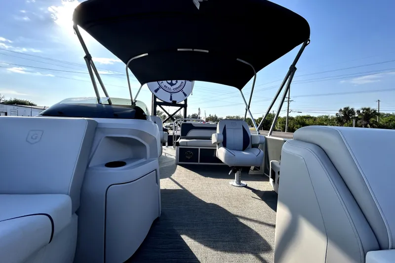 Slide: The Image of Electrical setup in a 2025 Godfrey Sweetwater 2286 SFL boat, featuring battery and wiring components. - 81