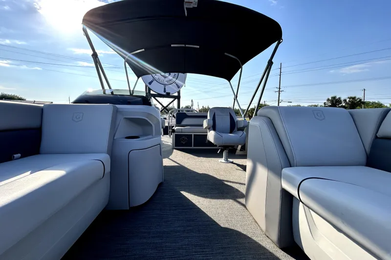 Slide: The Image of Trailer wheels of a 2025 Godfrey Sweetwater 2286 SFL pontoon boat on pavement. - 84