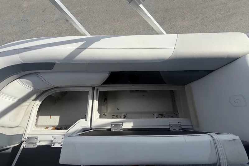 Slide: The Image of Open storage compartment on 2025 Godfrey Sweetwater 2286 SFL boat, showcasing interior space. - 49