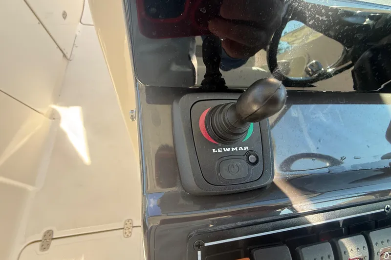 Slide: The Image of Joystick control on 2022 Pursuit DC 326 Dual Console boat dashboard. - 27