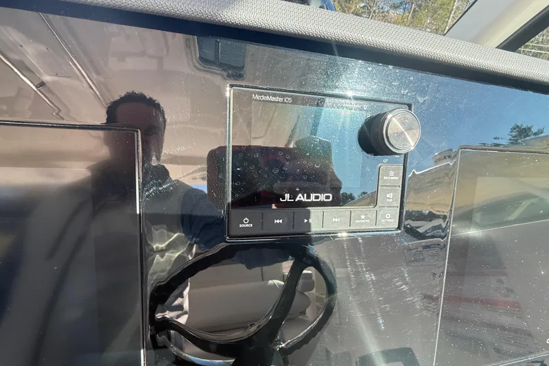 Slide: The Image of Dashboard of 2022 Pursuit DC 326 Dual Console with JL Audio system. - 30