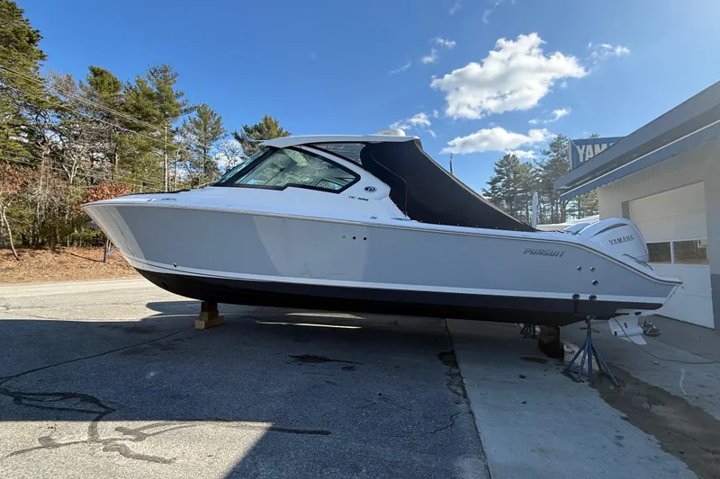 Slide: The Image of 2022 Pursuit DC 326 Dual Console boat on display outdoors. - 39