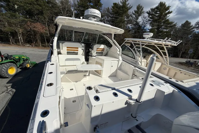 Slide: The Image of 2022 Pursuit DC 326 Dual Console boat with spacious deck and modern amenities. - 7